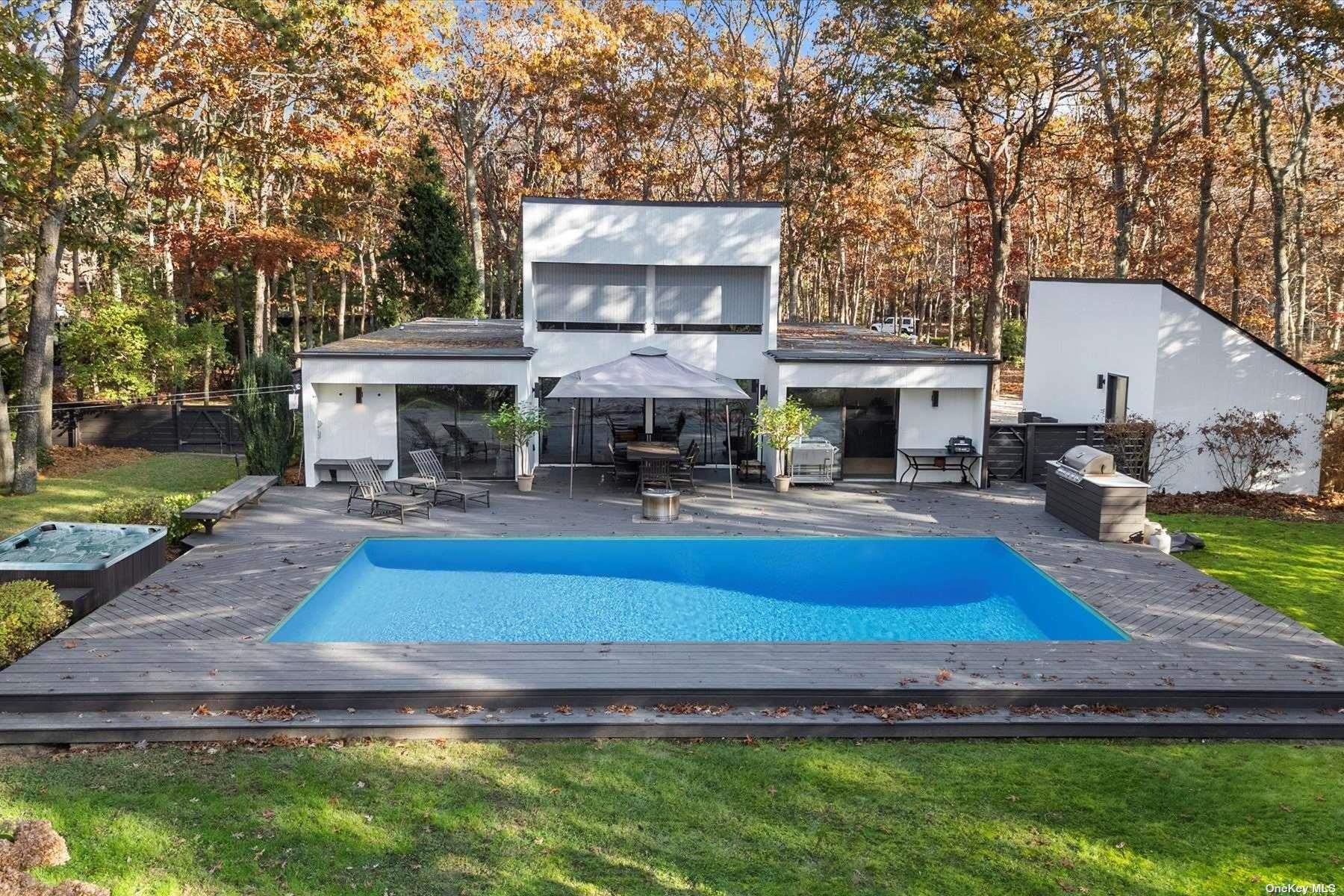 25 North Quarter Road Westhampton, NY 11977 - Photo 22 of 27 a swimming pool with outdoor seating and yard