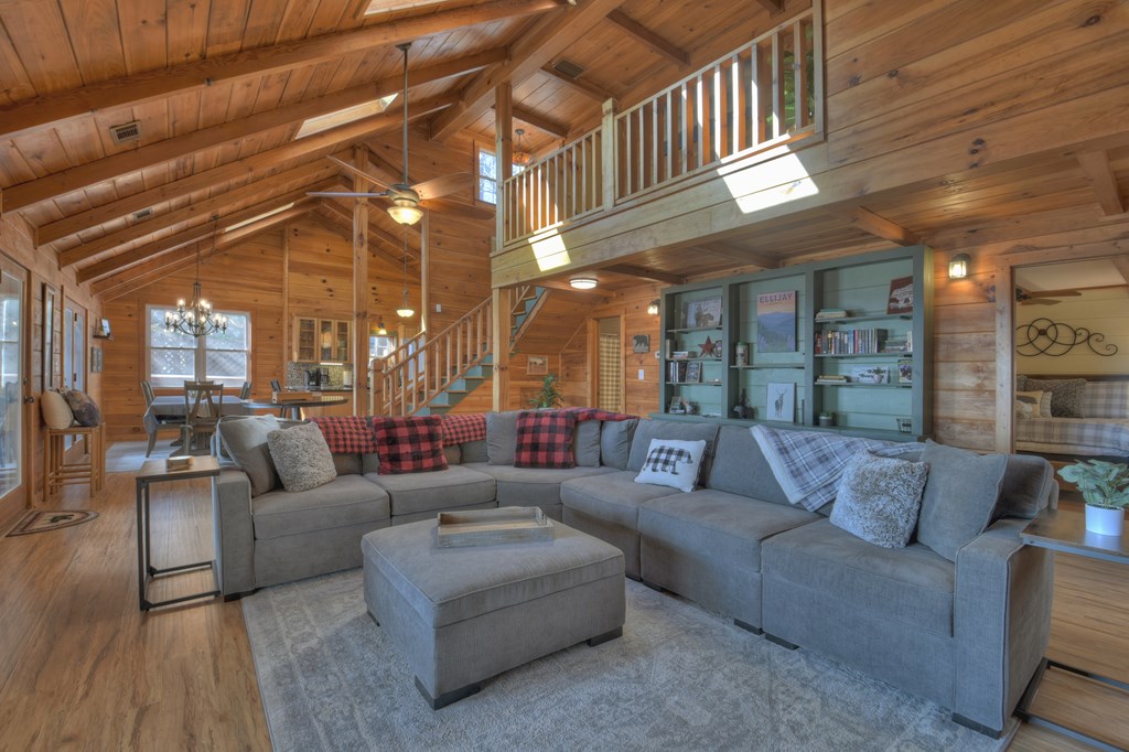 368 Walnut Ridge Ellijay, GA 30536 - Photo 14 of 41 a living room with furniture and a chandelier
