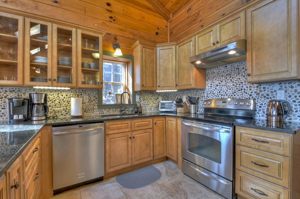 368 Walnut Ridge Ellijay, GA 30536 - Photo 20 of 41 a kitchen with stainless steel appliances granite countertop a sink and cabinets