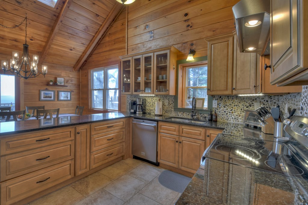 368 Walnut Ridge Ellijay, GA 30536 - Photo 21 of 41 a kitchen with granite countertop stainless steel appliances and sink