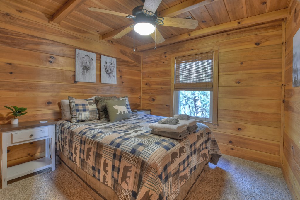 368 Walnut Ridge Ellijay, GA 30536 - Photo 31 of 41 a bed sitting in a spacious bedroom next to a window