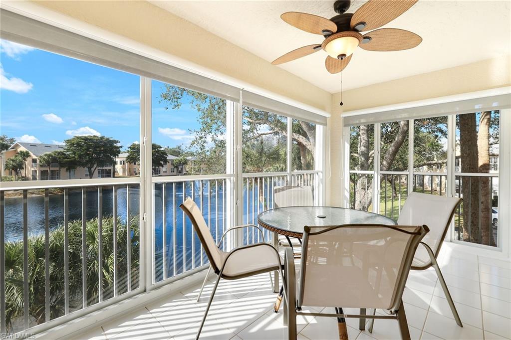 752 Wiggins Lake Drive, Unit 202 Naples, FL 34110 - Photo 4 of 44 Glass-enclosed sunroom adds a spacious 14-foot flex area