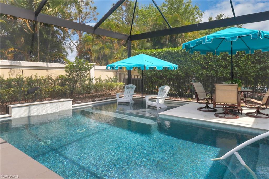 13836 Luna Drive Naples, FL 34109 - Photo 29 of 36 a swimming pool with outdoor seating and yard