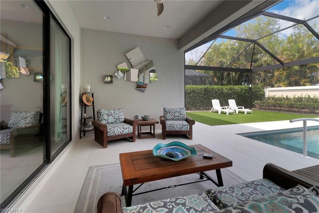 13836 Luna Drive Naples, FL 34109 - Photo 35 of 36 a living room with furniture and a window