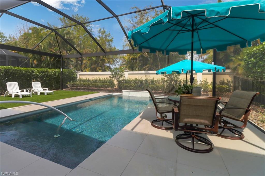 13836 Luna Drive Naples, FL 34109 - Photo 36 of 36 a view of a backyard with sitting area and furniture