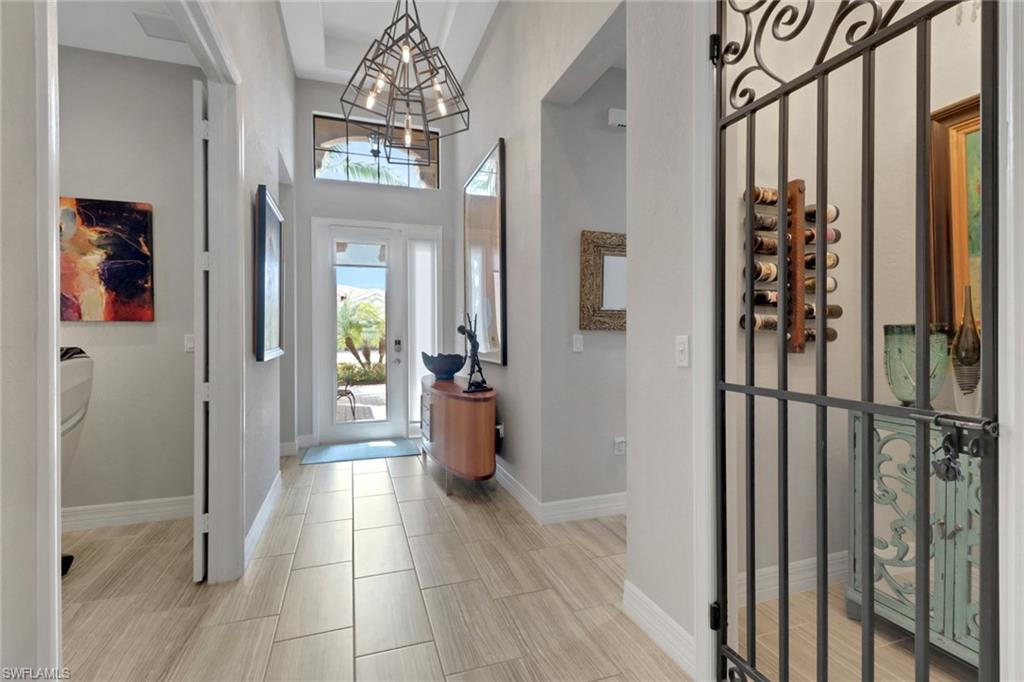 13836 Luna Drive Naples, FL 34109 - Photo 4 of 36 a view of an entryway with a livingroom
