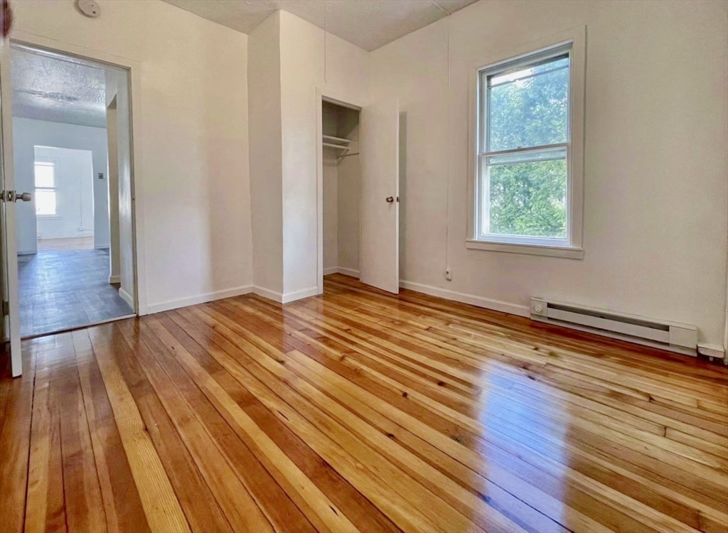 28 Randall Place Springfield, MA 01108 - Photo 14 of 22 a view of an empty room with wooden floor and a window