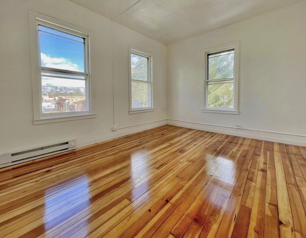 28 Randall Place Springfield, MA 01108 - Photo 15 of 22 a view of an empty room with wooden floor and a window