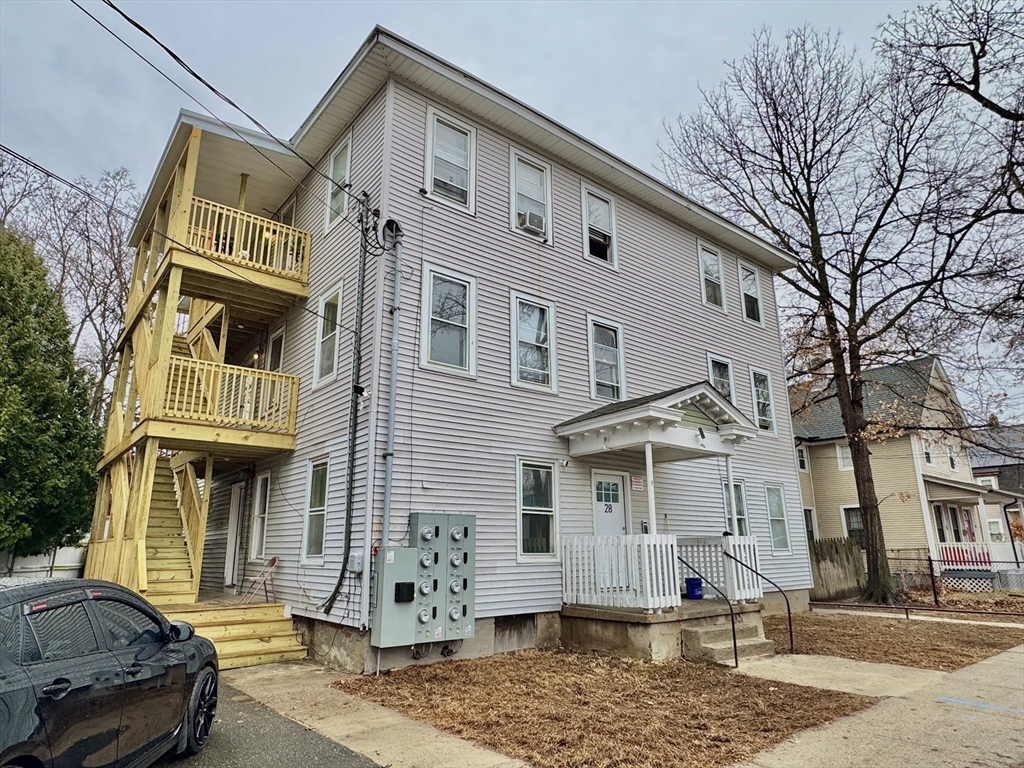 28 Randall Place Springfield, MA 01108 - Photo 2 of 22 a front view of a house with parking space