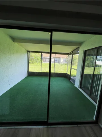 a view of a swimming pool with outdoor seating