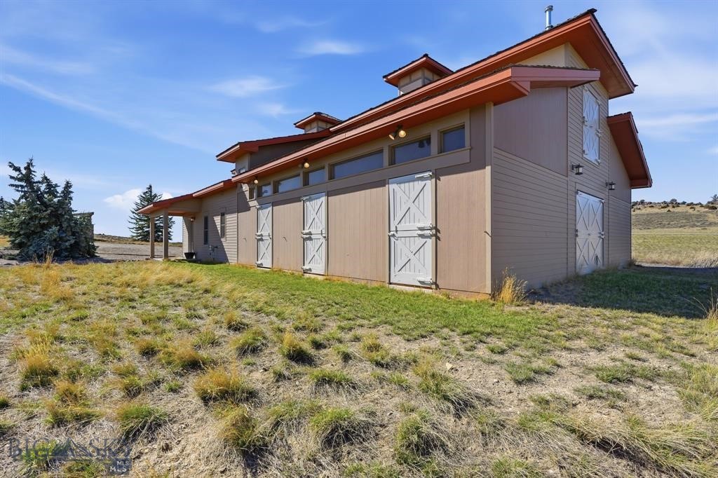 1240 Twin River Cutoff Road Manhattan, MT 59741 - Photo 5 of 88 Versatile and spacious shop/barn with five horse stalls, and convenient access to feeding