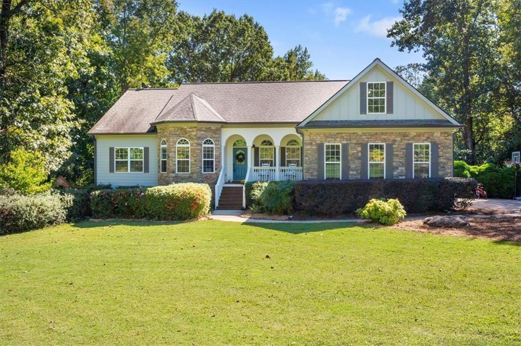 142 Stream Side Drive Pendergrass, GA 30567 - Photo 1 of 1 a front view of a house with yard and green space