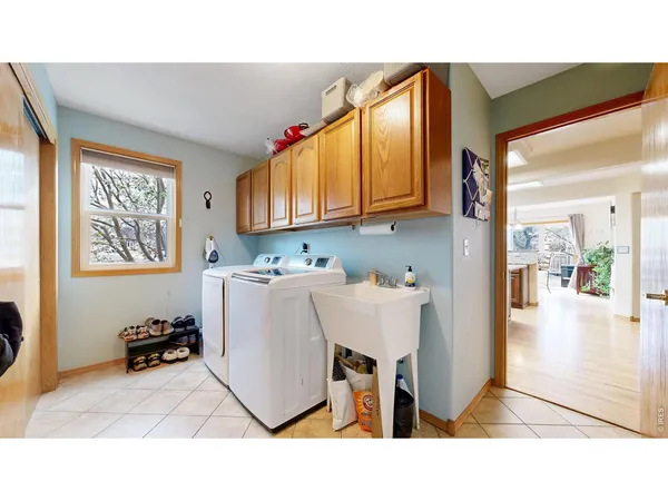 a living room with a sink and a window