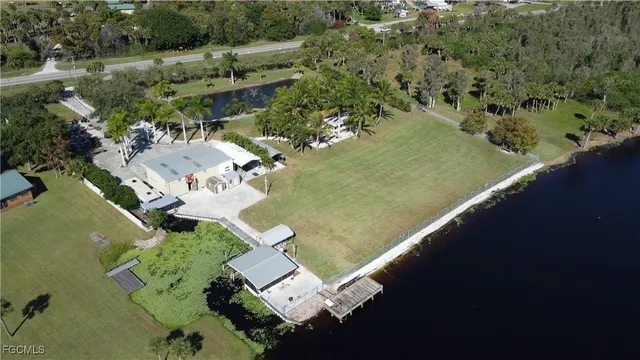 a swimming pool with outdoor seating and yard