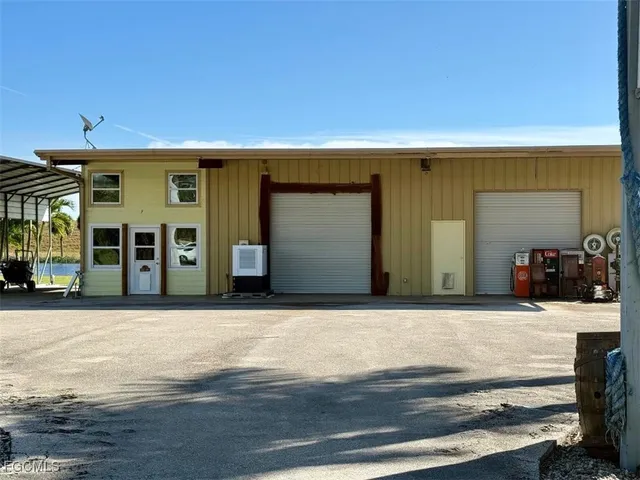 a white toilet sitting next to a shower curtain