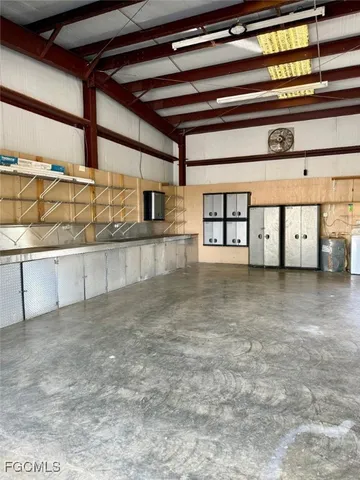 a room with granite countertop cabinets and utility room