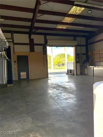 a view of a house with backyard sitting area and garden