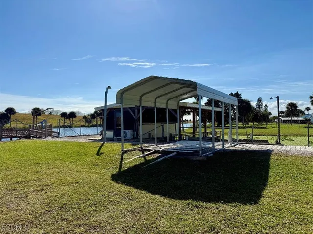 a view of a park with large trees