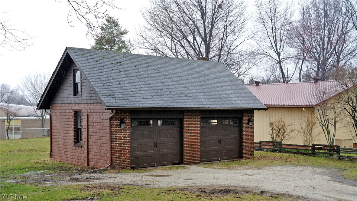 13182 Ridge Road North Royalton, OH 44133 - Photo 4 of 4 Two-car 528-sqft detached garage. Driveway is rough where a large dumpster was located during the house update & remodeling • More garage details, if it ever quits raining/snowing.