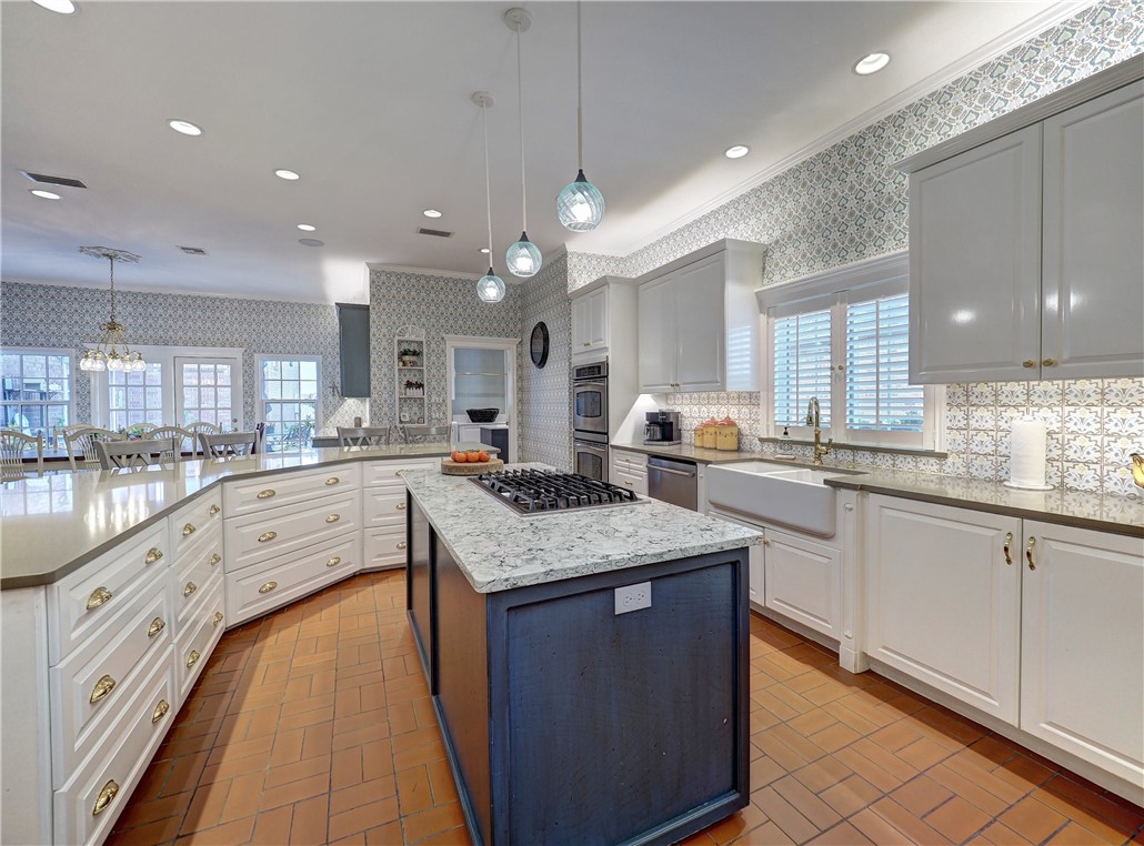334 Pebble Beach Drive Portland, TX 78374 - Photo 14 of 40 a large kitchen with granite countertop lots of counter space sink and appliances