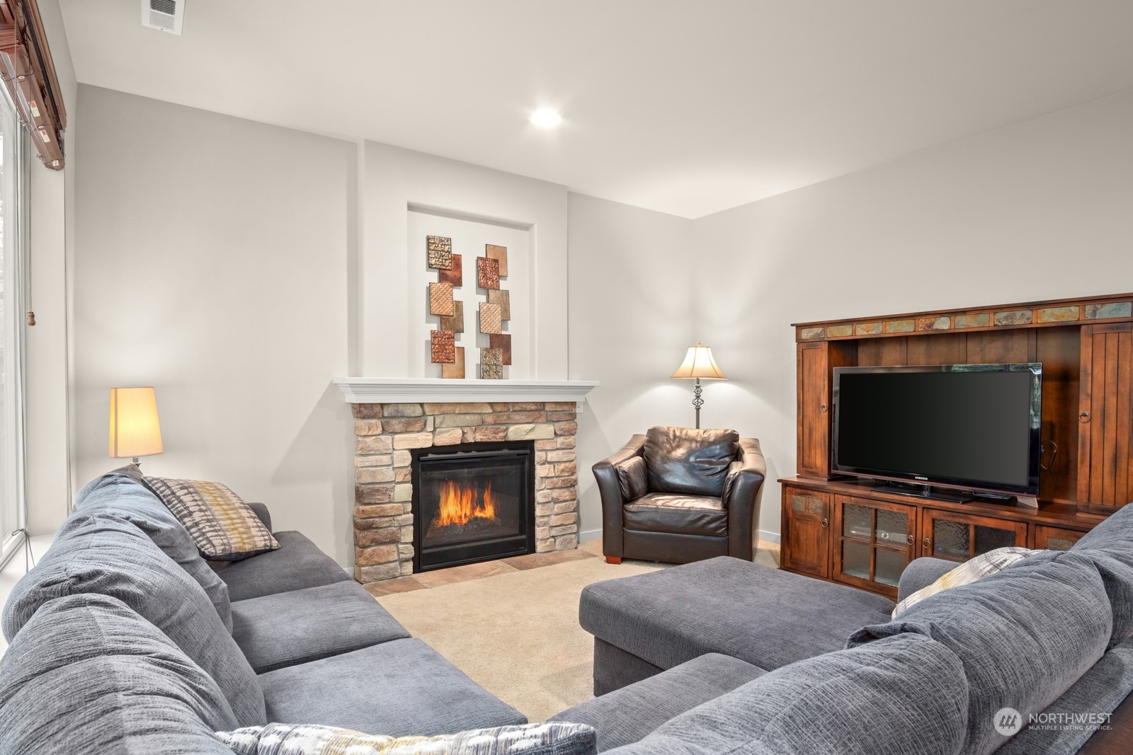4806 Northeast 3rd Place Renton, WA 98059 - Photo 11 of 32 a living room with furniture and a fireplace