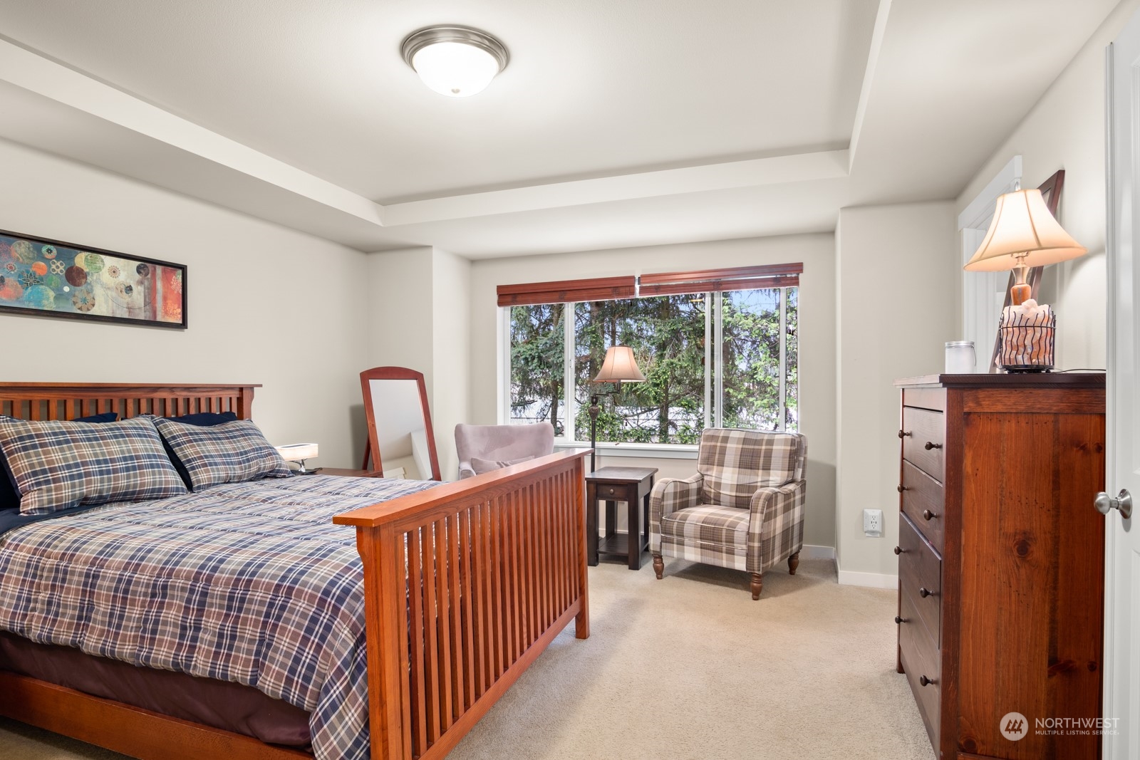 4806 Northeast 3rd Place Renton, WA 98059 - Photo 16 of 32 a bedroom with furniture and a large window