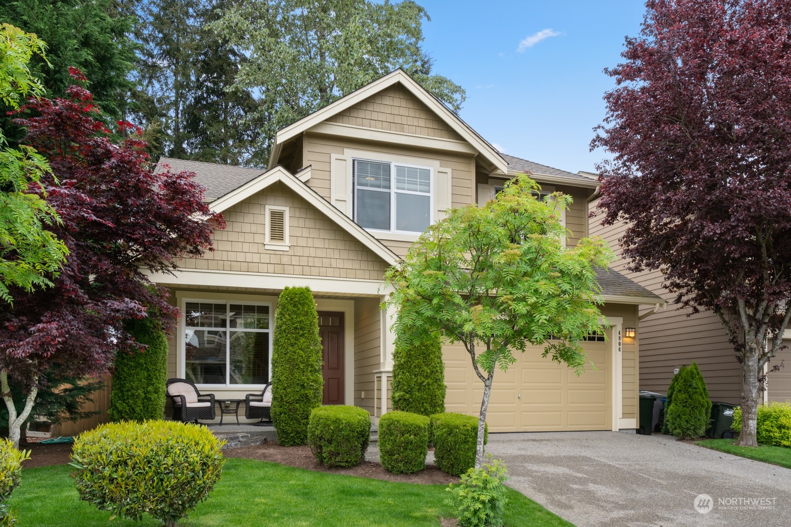4806 Northeast 3rd Place Renton, WA 98059 - Photo 2 of 32 a view of a house with a yard and potted plants