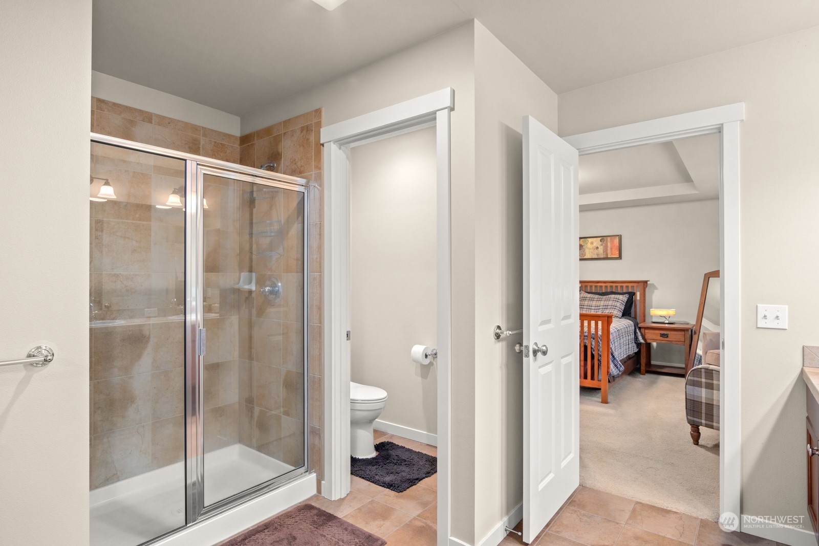 4806 Northeast 3rd Place Renton, WA 98059 - Photo 21 of 32 a bathroom with a glass shower door
