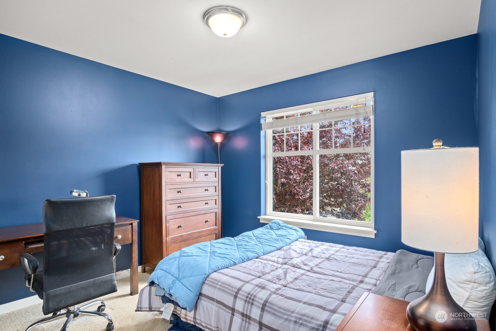 4806 Northeast 3rd Place Renton, WA 98059 - Photo 22 of 32 a bedroom with a bed and a window