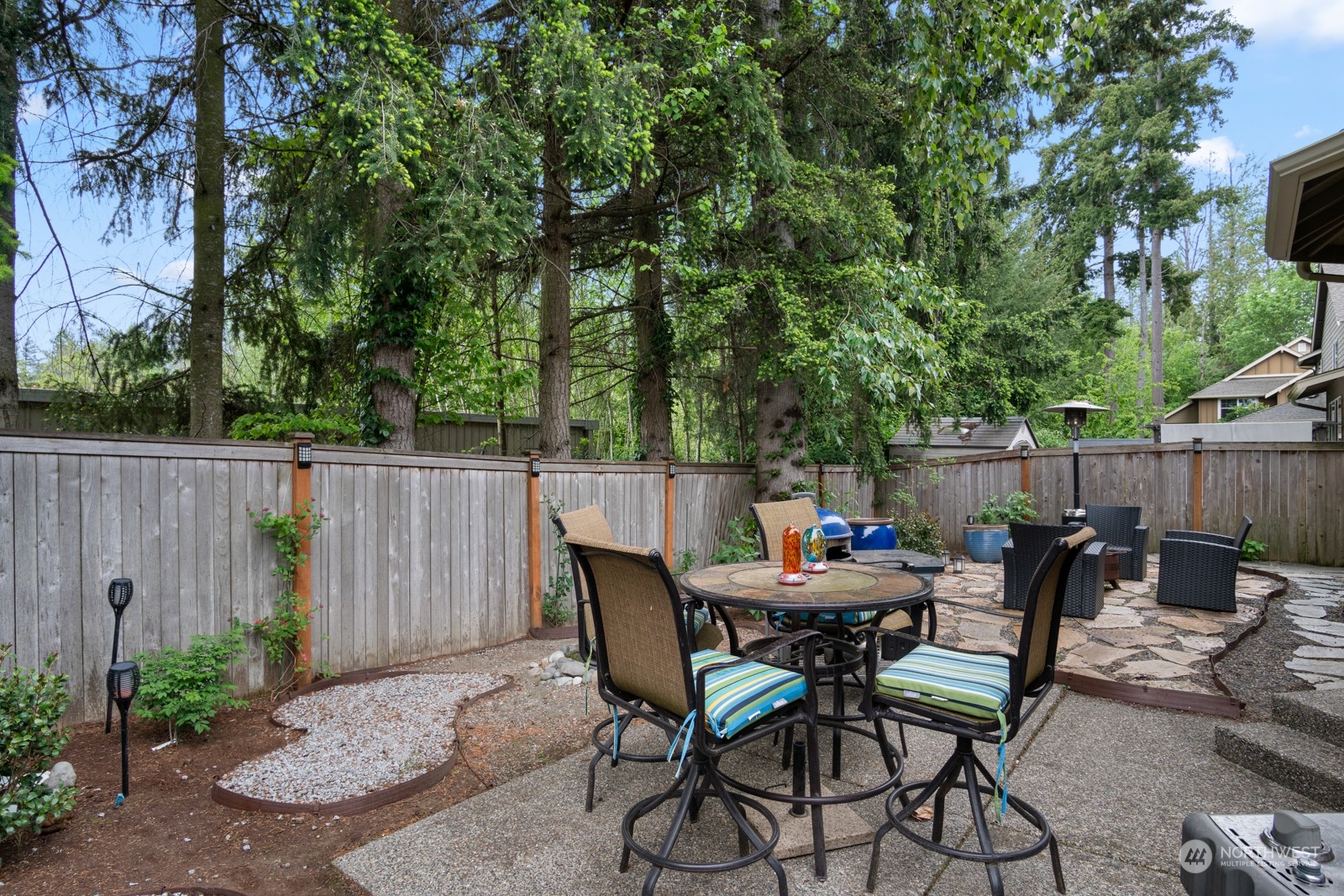4806 Northeast 3rd Place Renton, WA 98059 - Photo 27 of 32 a view of a chairs and table in backyard