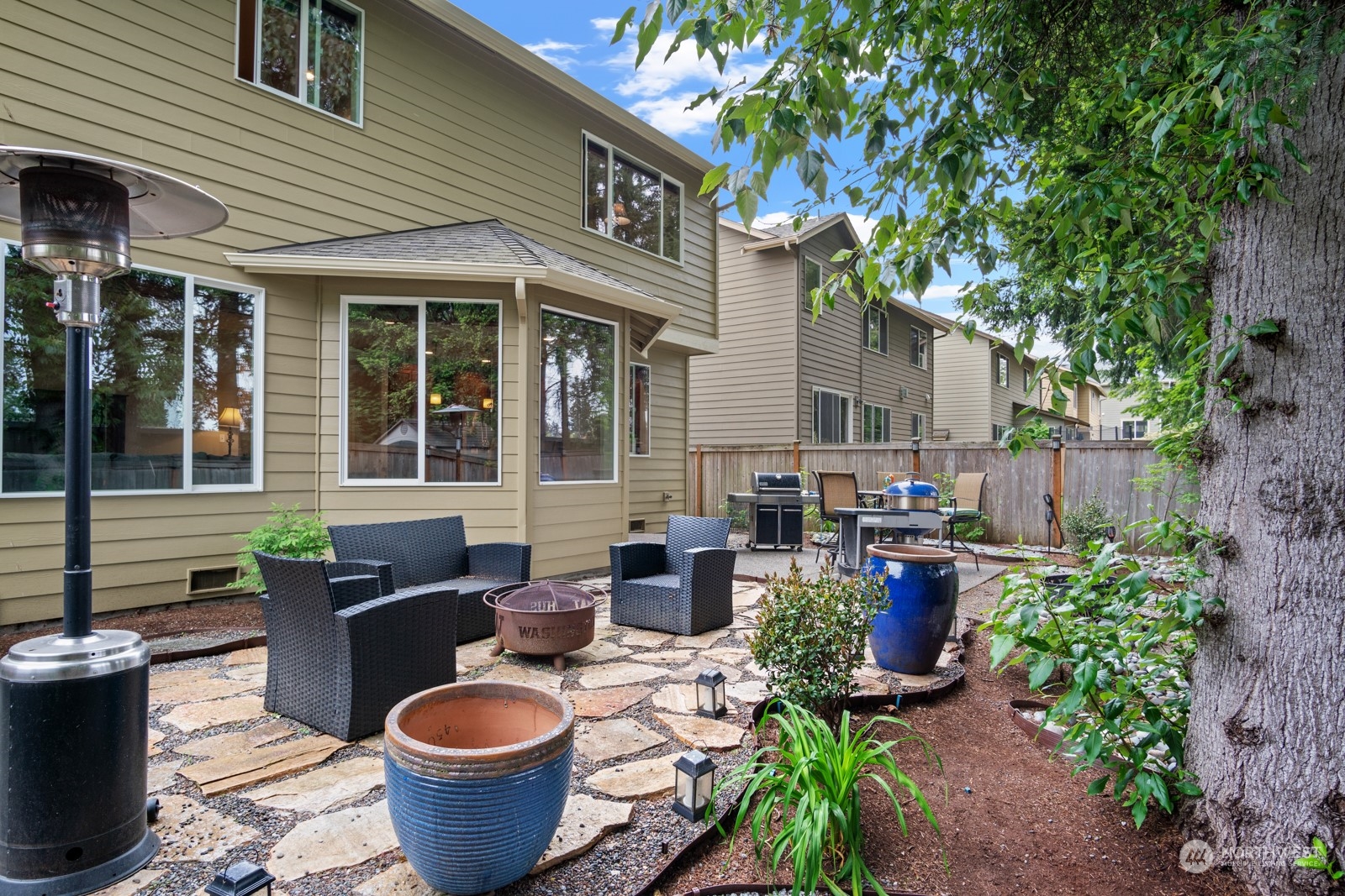 4806 Northeast 3rd Place Renton, WA 98059 - Photo 30 of 32 a view of a patio that has couches chairs and a potted plant