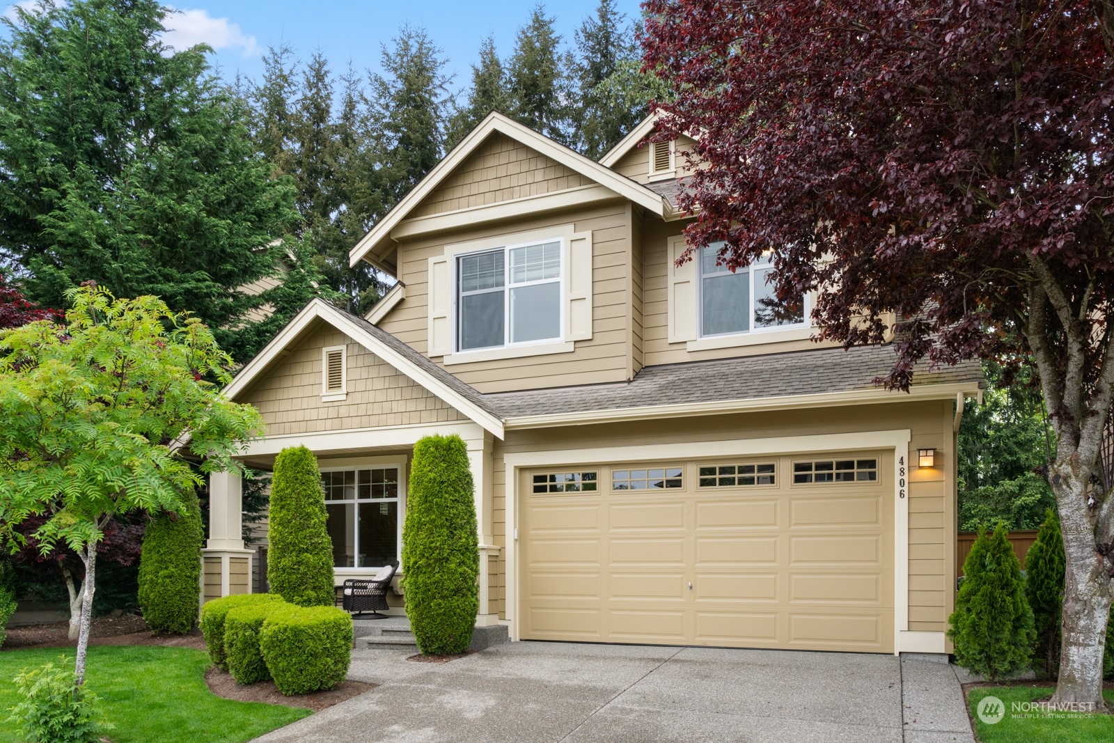 4806 Northeast 3rd Place Renton, WA 98059 - Photo 3 of 32 a view of a house with a yard plants and large tree