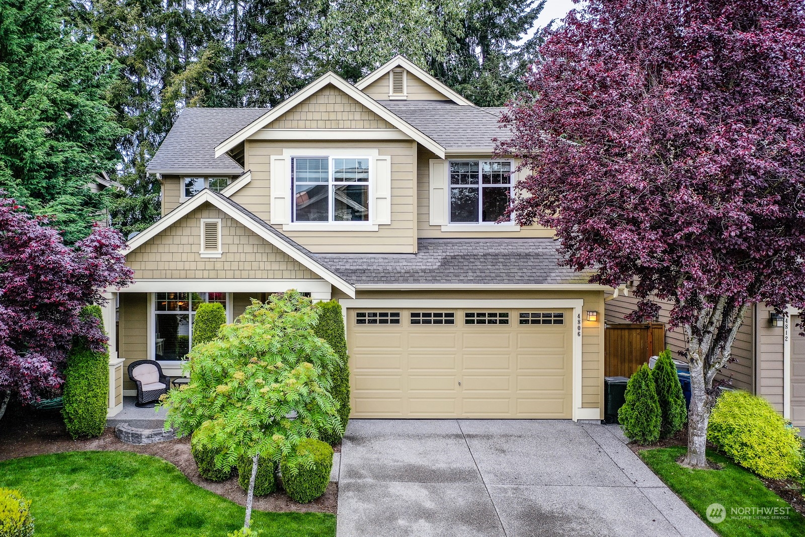 4806 Northeast 3rd Place Renton, WA 98059 - Photo 31 of 32 a front view of a house with a garden and plants