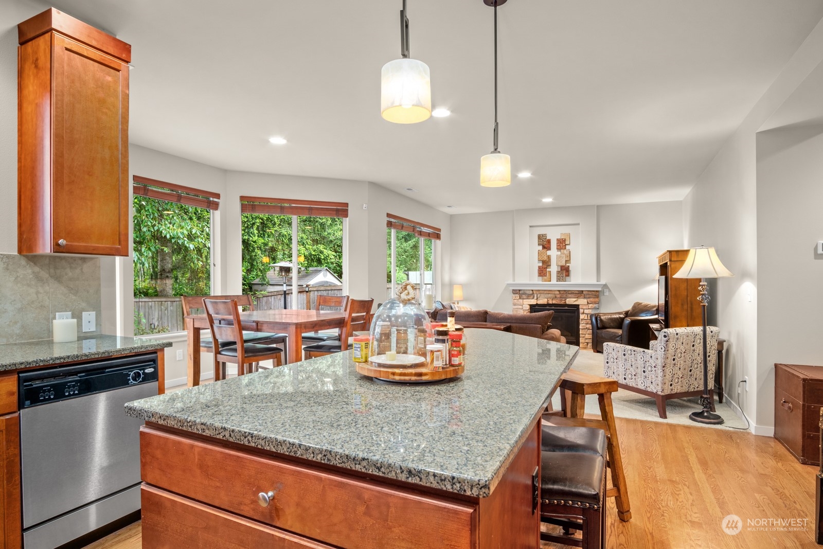 4806 Northeast 3rd Place Renton, WA 98059 - Photo 9 of 32 a kitchen with a stove and living room view