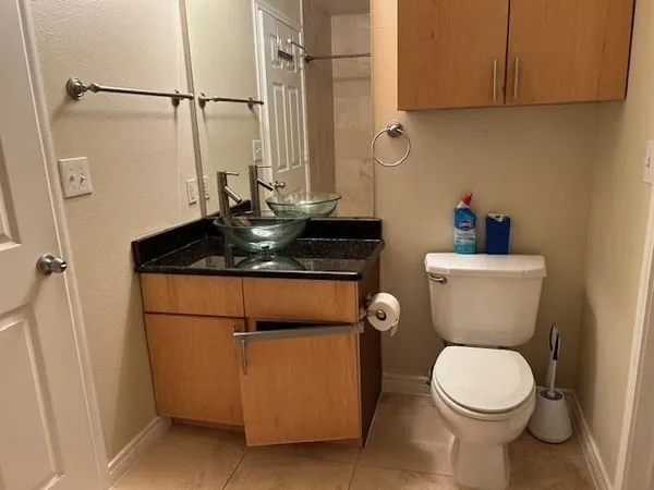 a bathroom with a toilet a sink and a shower
