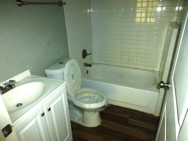 314 North Dubellette Street Weatherford, TX 76086 - Photo 14 of 17 a bathroom with a sink and toilet