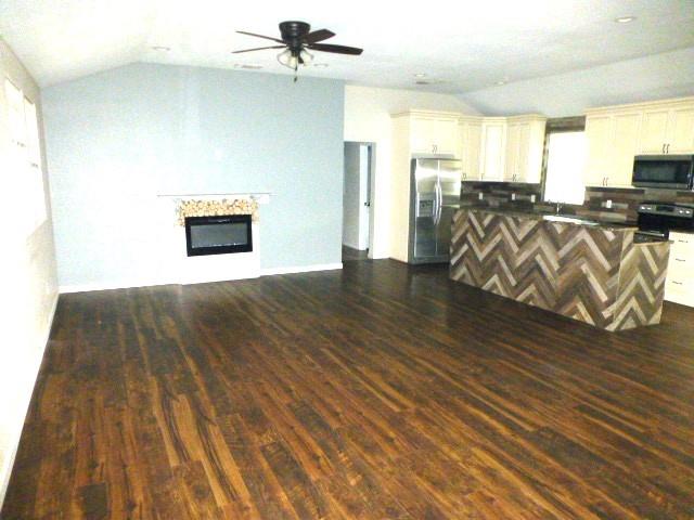 314 North Dubellette Street Weatherford, TX 76086 - Photo 5 of 17 a view of a livingroom with wooden floor