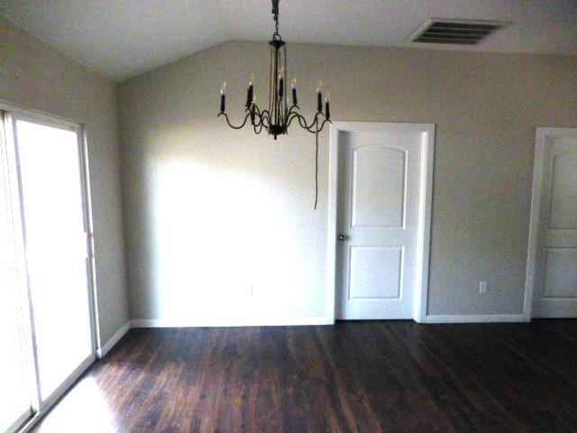 314 North Dubellette Street Weatherford, TX 76086 - Photo 7 of 17 a view of a room with wooden floor and windows