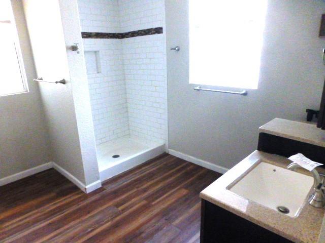 314 North Dubellette Street Weatherford, TX 76086 - Photo 9 of 17 a bathroom with a sink and a mirror