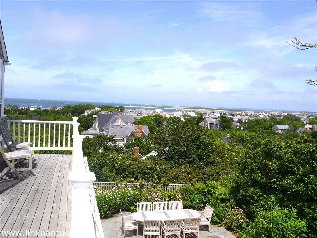 47 Cliff Road Nantucket, MA 02554 - Photo 13 of 22 a view of a balcony with wooden floor and city view