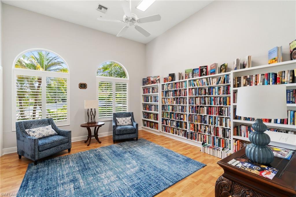 734 Regency Reserve Circle, Unit 2702 Naples, FL 34119 - Photo 40 of 48 a living room with furniture and a large window