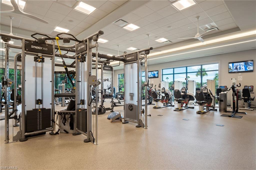 734 Regency Reserve Circle, Unit 2702 Naples, FL 34119 - Photo 41 of 48 a view of a room with gym equipment