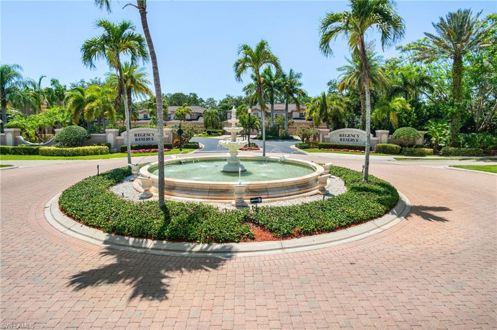 734 Regency Reserve Circle, Unit 2702 Naples, FL 34119 - Photo 45 of 48 a view of a water fountain with palm trees