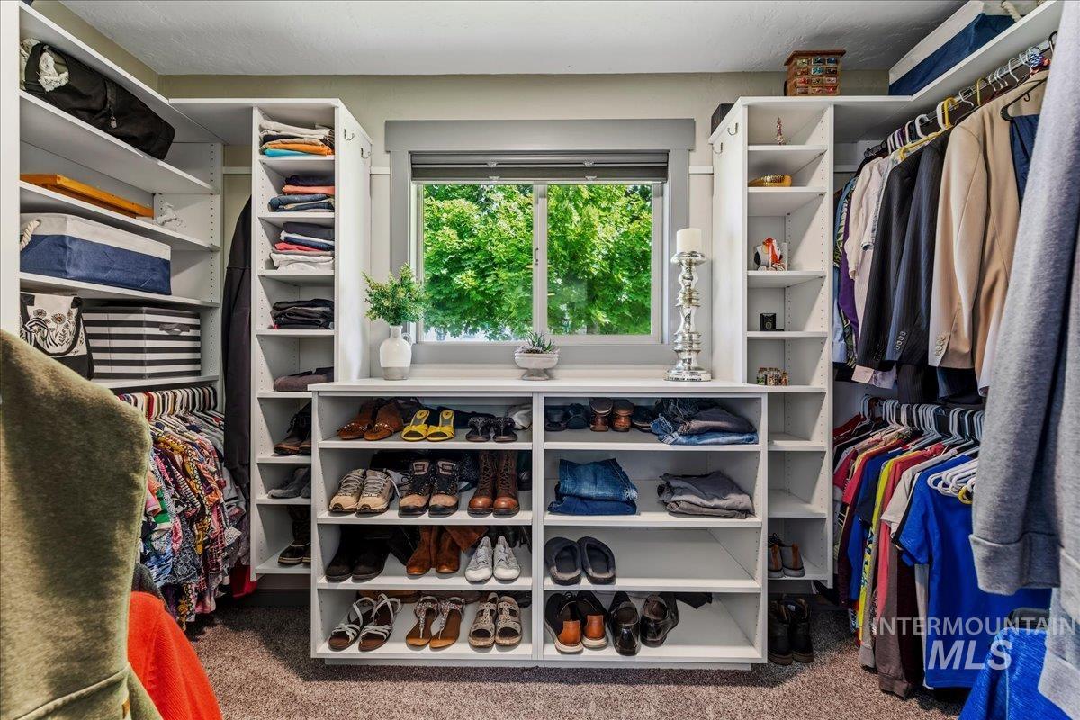 6323 Foothill Road Star, ID 83669 - Photo 28 of 50 Custom closet system featuring built-in shelving, hanging rods, and an integrated window