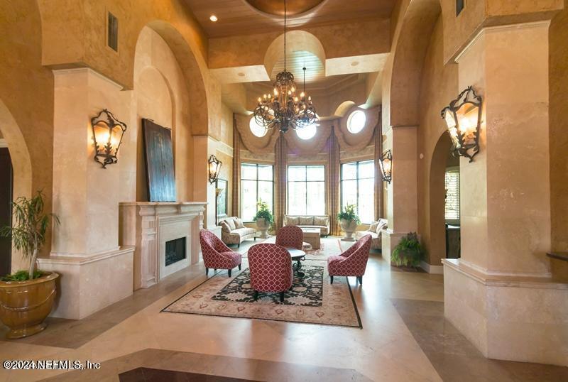 9745 Touchton Road, Unit 1805 Jacksonville, FL 32246 - Photo 19 of 77 a dining room with furniture a chandelier and wooden floor