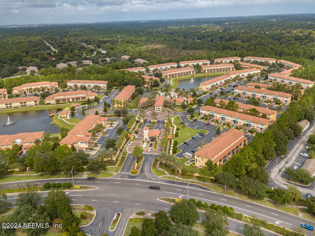 9745 Touchton Road, Unit 1805 Jacksonville, FL 32246 - Photo 29 of 77 an aerial view of residential building with outdoor space lake and green space