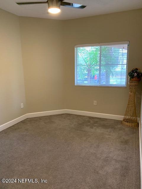 9745 Touchton Road, Unit 1805 Jacksonville, FL 32246 - Photo 36 of 77 a view of an empty room with a window
