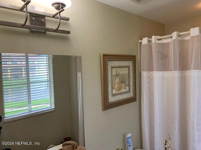 9745 Touchton Road, Unit 1805 Jacksonville, FL 32246 - Photo 54 of 77 a view of a livingroom with a window