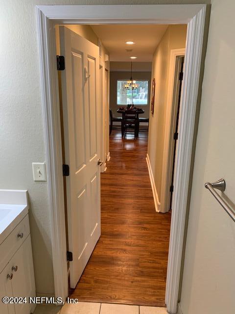 9745 Touchton Road, Unit 1805 Jacksonville, FL 32246 - Photo 58 of 77 a view of a hallway with wooden floor and staircase