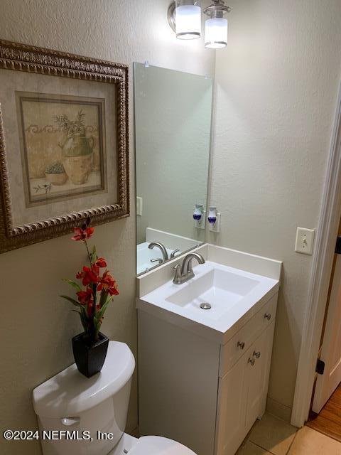 9745 Touchton Road, Unit 1805 Jacksonville, FL 32246 - Photo 59 of 77 a bathroom with a sink a vanity and a mirror
